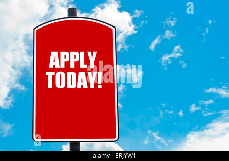 Apply Today  motivational quote written on red road sign isolated over clear blue sky background. Stock Photo