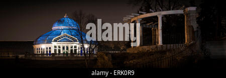 The Marjorie McNeely Conservatory and frog pond. The Palm Dome was lit up blue on April 2 for World Autism Awareness Day. The co Stock Photo
