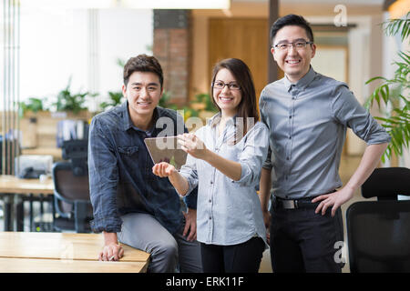 IT workers developing digital tablet Stock Photo