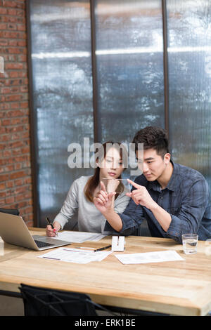 IT workers developing smart phone Stock Photo