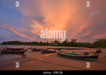 Longtail boats at sunset on Koh Lanta, Thailand Stock Photo