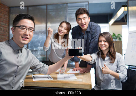 IT workers developing smart phone Stock Photo