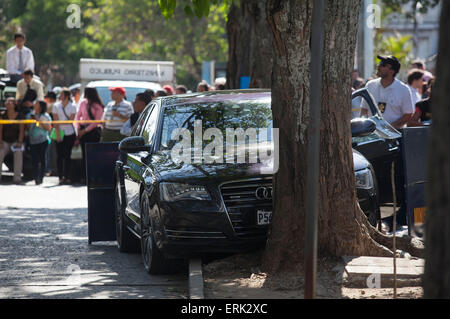 Guatemala City, Guatemala. 3rd June, 2015. Onlookers stand at the site where lawyer Francisco Palomo was shot dead, in Guatemala City, capital of Guatemala, on June 3, 2015. Palomo, 64, a leading member of former Guatemalan dictator Efrain Rios Montt's defense team, was shot dead by two men on a motorbike while driving his car in Guatemala City, according to a preliminary police report. © Luis Echeverria/Xinhua/Alamy Live News Stock Photo