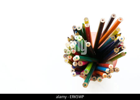 Overhead view of multicolored coloring pencils in pots isolated on white background Stock Photo