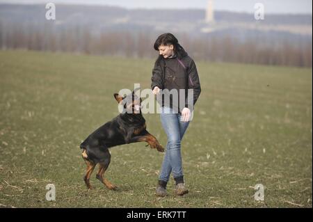woman and Rottweiler Stock Photo