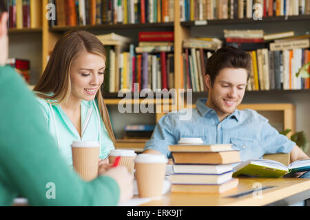 students reading and drinking coffee in library Stock Photo