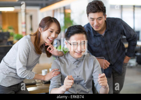 IT workers developing digital tablet Stock Photo
