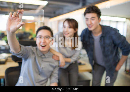 IT workers developing smart phone Stock Photo