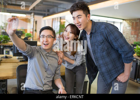 IT workers developing smart phone Stock Photo