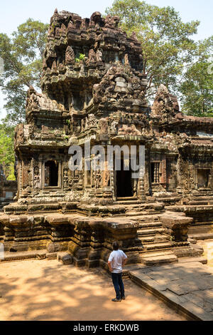 Tourist in front of the Prasat, Chau Say Tevoda temple, Angkor, Siem Reap Province, Cambodia Stock Photo