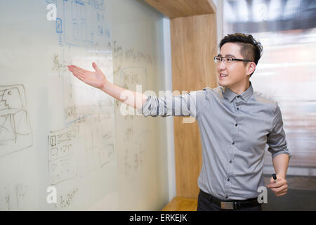Businessman showing the whiteboard Stock Photo