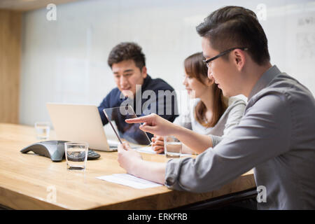 IT workers developing digital tablet Stock Photo