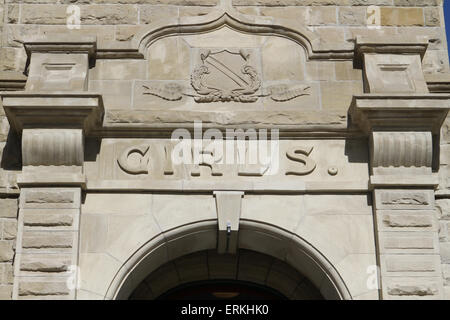 Sandstone school building with separate boys and girls entrances Stock Photo