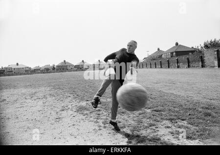 Liverpool manager Bill Shankly, aged 57,  keeps himself  fit by practicing his football skills at the club's training ground. 2nd June 1971. Stock Photo