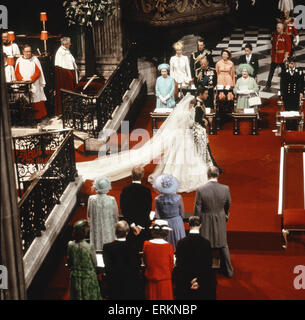 Princess Diana and Prince Charles walking down the isle being watched by both families after their wedding ceremony. There were 3,500 people in the congregation at St Paul's Cathedral. It was held at St Paul's rather than Westminster Abbey because St Paul Stock Photo