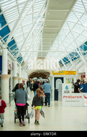 shoppers main thoroughfare Serpentine Green Shopping Centre, Peterborough PE7 8BE. The site is owned by British Land PLC. Stock Photo