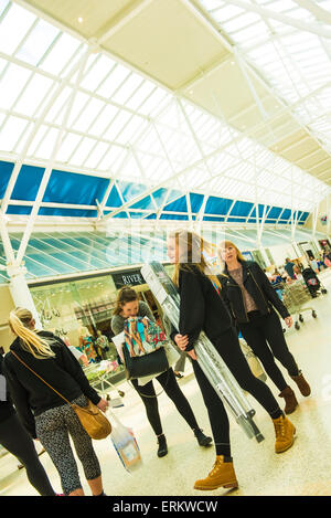 shoppers main thoroughfare Serpentine Green Shopping Centre, Peterborough PE7 8BE. The site is owned by British Land PLC. Stock Photo