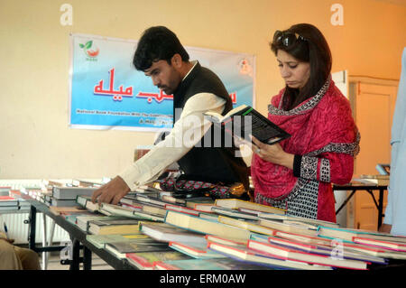 Visitors take keen interest at stall during Books Exhibition arranged by Quetta Press Club and Publisher Association held at Quetta press club on Thursday, June 04, 2015. Stock Photo