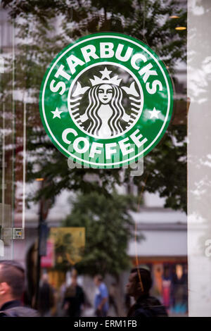 PRAGUE, CZECH REPUBLIC - MAY 25, 2015: Starbucks Coffee logo in Prague restaurant shop window. Stock Photo