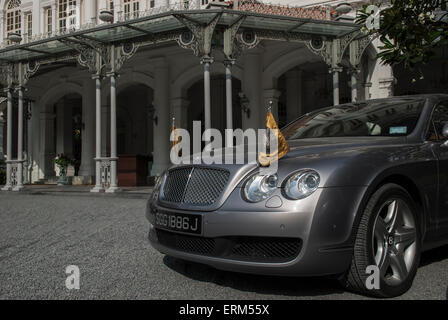 Expensive car in front of Raffles Hotel, Singapore Stock Photo