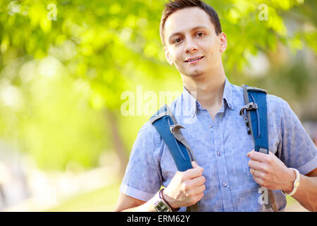 bright picture of travelling student with backpack and book Stock Photo