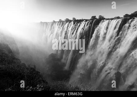 Africa, Zambia, Mosi-Oa-Tunya National Park,  Setting sun lights Eastern Cataract of Victoria Falls