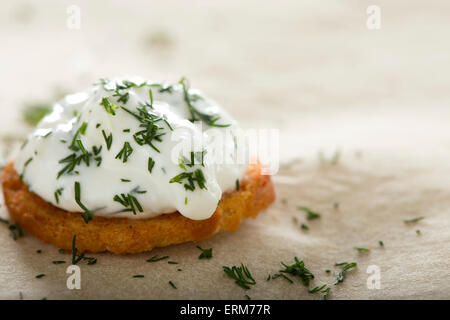 Close up of one fresh cream cheese spread with dill on bake rolls Stock Photo