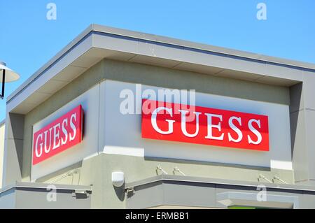 Funchal, Portugal - Oct 23, 2021: Guess store sign. Guess is an