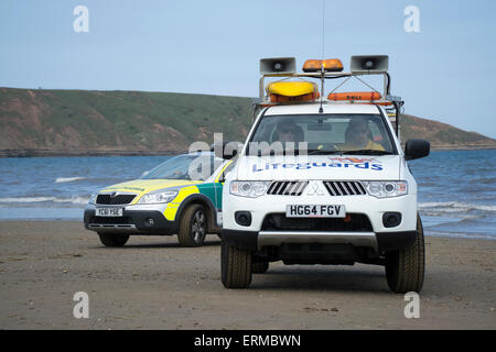 RNLI Lifeguard and Ambulance Service Paramedic in training excercise Stock Photo