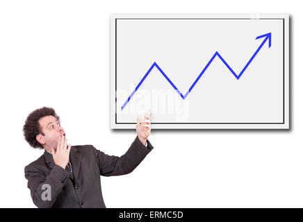 Shocked man in a suit shows a hand on the board with growing arrow Stock Photo
