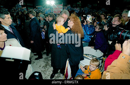 Ann Arbor, Michigan Oct. 1992 Presidential candidate Governor William Clinton arrives at the University of Michigan at Ann Arbor for the final debate with the incumbent President George H.W. Bush  and pauses to hold another baby. Stock Photo