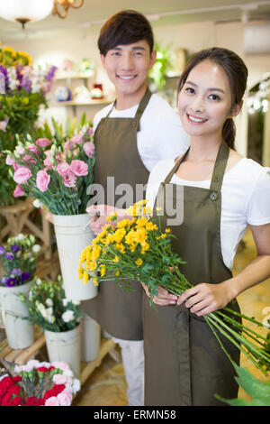 Florists working in shop Stock Photo