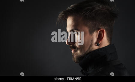 Stylish brutal hipster on dark background Stock Photo