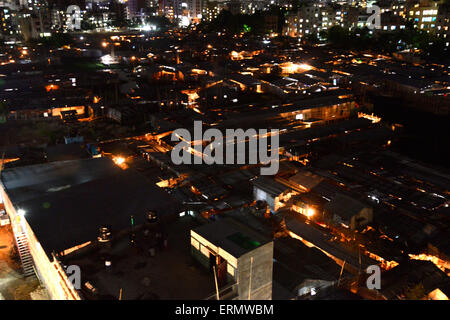 Dhaka, Bangladesh . 5th June, 2015. A Night view of Rupnagar slum at Mirpur in Dhaka, Bangladesh.ON June 4, 2015  Bangladesh is one of the world's most densely populated countries. Millions of people have settled in slums of Dhaka, a mega city, mostly living in risky settlements after knowing all the possibilities of accidents. The slum people even do not have access to basic amenities. Credit:  Mamunur Rashid/Alamy Live News Stock Photo