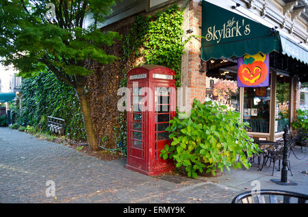 Corner of building by Skylark's restaurant in downtown Fairhaven, Bellingham, Washington, USA.  Red British telephone box. Stock Photo