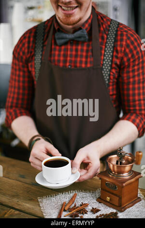 barista holding tamper near portafilter with grinded coffee, espresso, manual  press Stock Photo by LightFieldStudios