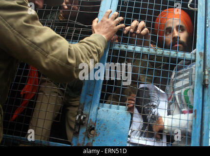 Srinagar, Kashmir. 5th June, 2015. Sikhs are detained by Indian security forces during a protest against removed posters of Sikh leader Jarnail Singh Bhindranwa.they demand action against those responsible for the killing of a Sikh youth.On Thursday ,An indefinite curfew imposed in parts of Jammu following violence over Sikh militant leader Jarnail Singh Bhindranwale's posters continued for a second day on Friday Credit: Sofi Suhail/Alamy Live News Stock Photo
