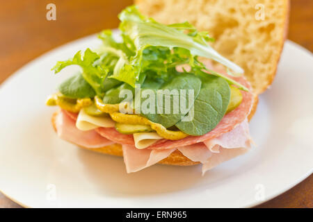 Ciabatta roll Italian meat sub sandwich with provolone ham and salami Stock Photo