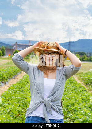Portrait of beautiful young woman  in the field Stock Photo