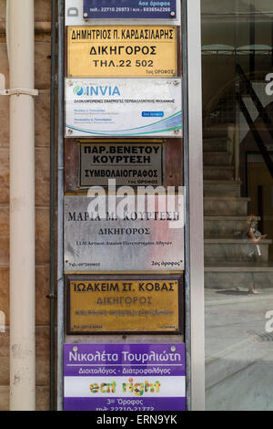 Row of name plates in greek language in the city of Chios on the isle of Chios, Greece Stock Photo