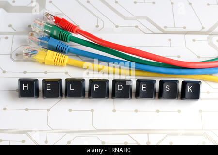 IT HELP, Assistance - HELPDESK made of keyboard keys with colourful network cables on white circuit board background Stock Photo