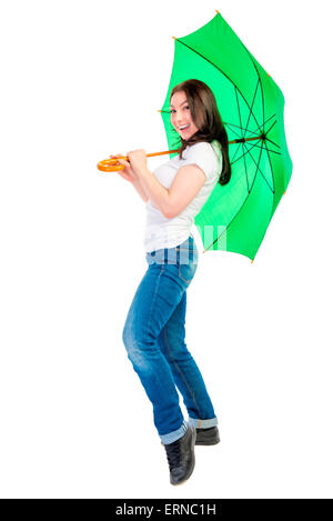 cheerful young woman with a green umbrella cane Stock Photo