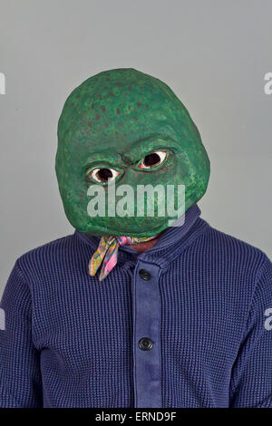 Creepy bald lizard man wearing a blue sweater Stock Photo