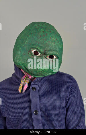 Creepy bald lizard man wearing a blue sweater Stock Photo