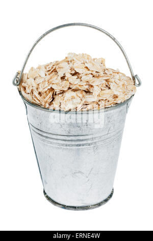 Bucket with  oat flakes, isolated on white background Stock Photo