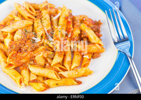 Penne pasta with ground beef meat sauce Stock Photo