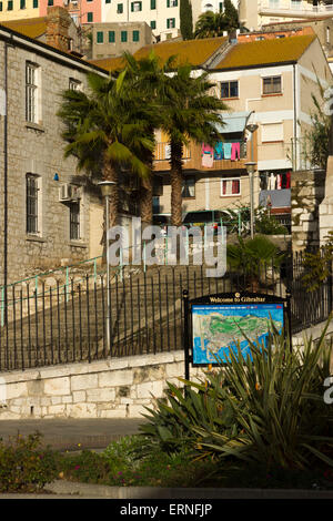 Gibraltar welcome sign with apartments and palm trees in the background Stock Photo