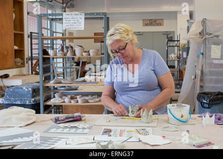 Biloxi, Mississippi - A potter works in the City of Biloxi Center for Ceramics at the Ohr-O'Keefe Museum of Art. Stock Photo