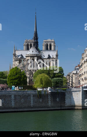 A view of the pre-fire east facade of the medieval gothic Notre Dame de Paris cathedral in summer 2014 taken from the Quai d'Orléans, Paris, France Stock Photo