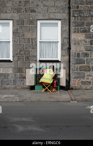 guernsey phone and communication engineer working in telecommunications box Stock Photo
